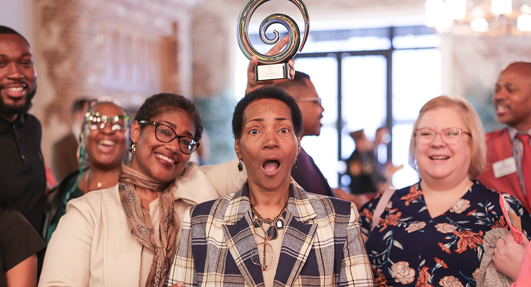 Large group of smiling attendees at the Summit DD Appreciation Breakfast.