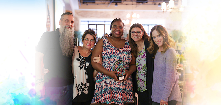 Large group of smiling attendees at the Summit DD Appreciation Breakfast.
