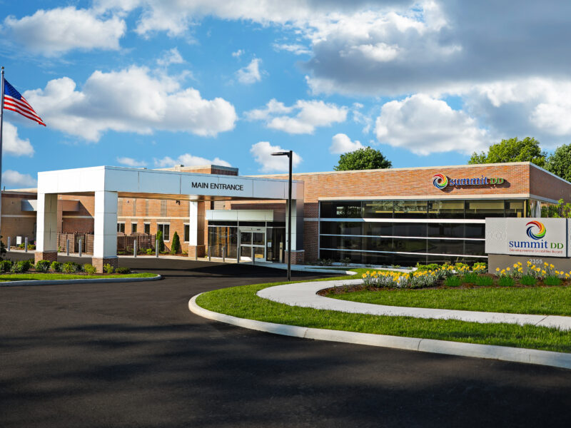 Outdoor photo of Summit DD Cuyahoga Falls center. Blue sky. White clouds.
