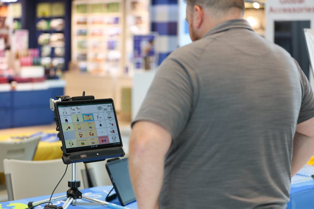 An individual exploring technology at the 2026 Interactive Tech Expo.