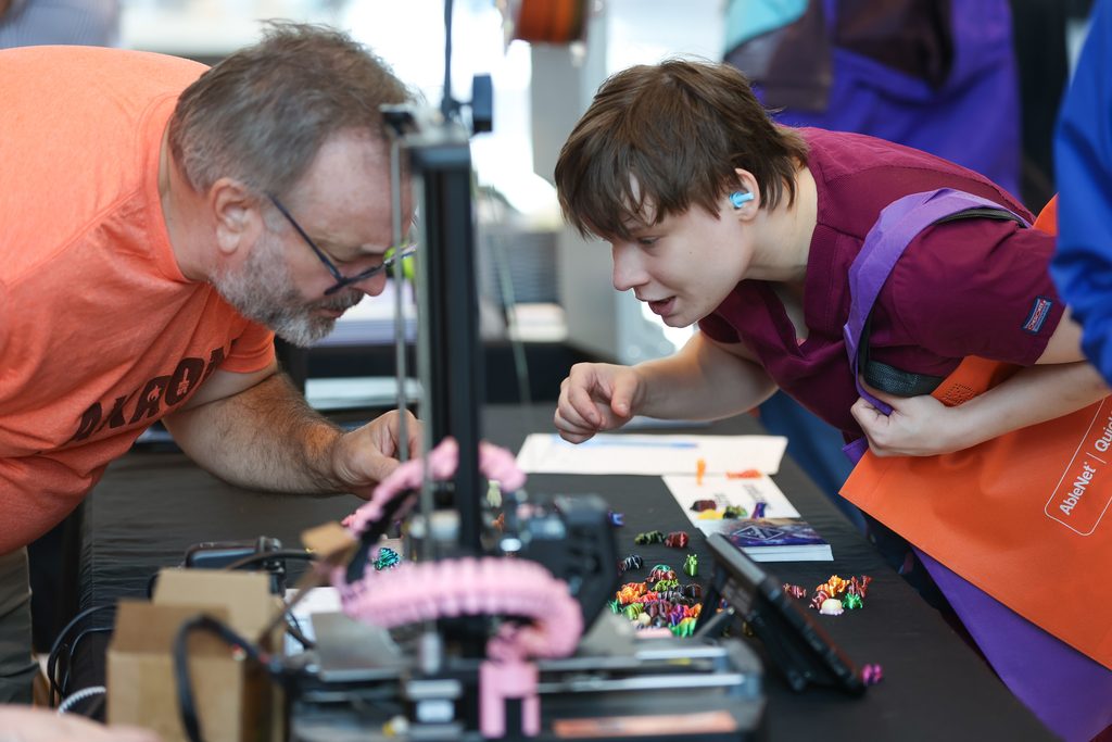 An individual exploring technology at the 2026 Interactive Tech Expo.