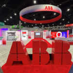Custom island trade show booth exhibit featuring 3D animated virtual displays for ABB at Distributech 2026