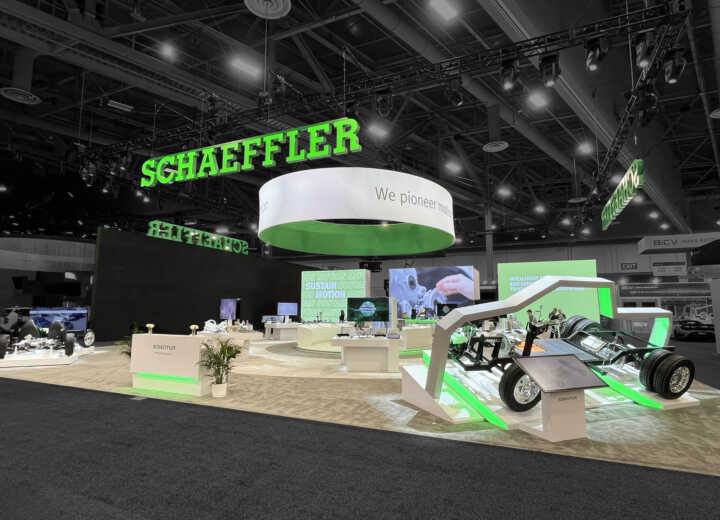 Custom exhibit booth with LED video towers, raised platforms and product kiosks for Schaeffler at CES 2025