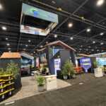 Custom island double deck exhibit for Green Corp American Plastics at Inspired Home 2026
