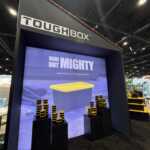 Custom island double deck exhibit for Green Corp American Plastics at Inspired Home 2026