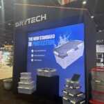 Custom island double deck exhibit for Green Corp American Plastics at Inspired Home 2026