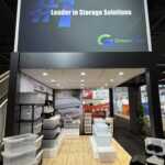 Custom island double deck exhibit for Green Corp American Plastics at Inspired Home 2026