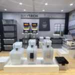 Custom island double deck exhibit for Green Corp American Plastics at Inspired Home 2026