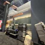 Custom island double deck exhibit for Green Corp American Plastics at Inspired Home 2026