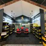 Custom island double deck exhibit for Green Corp American Plastics at Inspired Home 2026