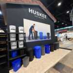 Custom island double deck exhibit for Green Corp American Plastics at Inspired Home 2026