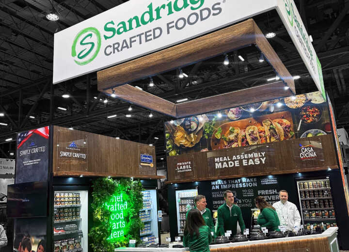 Custom island exhibit with natural elements for Sandridge at IDDBA 2025