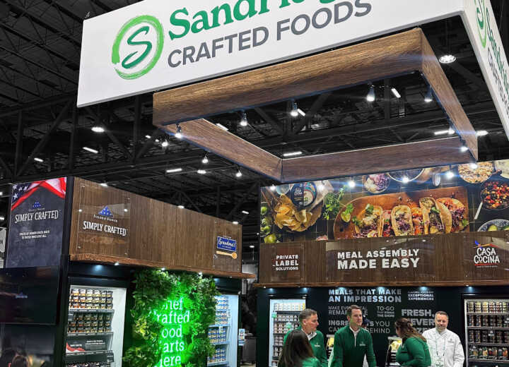 Custom island exhibit with natural elements for Sandridge at IDDBA 2025