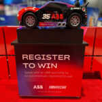 Custom exhibit island trade show booth for ABB at IEEE 2026