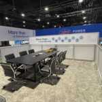 Custom island double deck rental exhibit for JST at IEEE 2026
