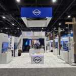 Island booth custom build double deck rental exhibit for PLP at IEEE 2026