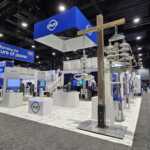 Island booth custom build double deck rental exhibit for PLP at IEEE 2026