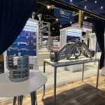 Island booth custom build double deck rental exhibit for PLP at IEEE 2026