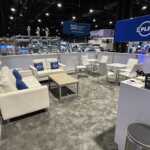 Island booth custom build double deck rental exhibit for PLP at IEEE 2026