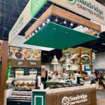 Custom island booth for Sandridge at IDDBA 2026