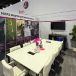 Custom split island booth for Fives Pietro at IMTS 2026