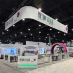 Custom split island booth for Fives Pietro at IMTS 2026
