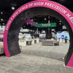 Custom split island booth for Fives Pietro at IMTS 2026
