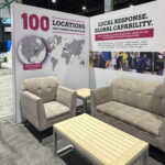 Custom split island booth for Fives Pietro at IMTS 2026