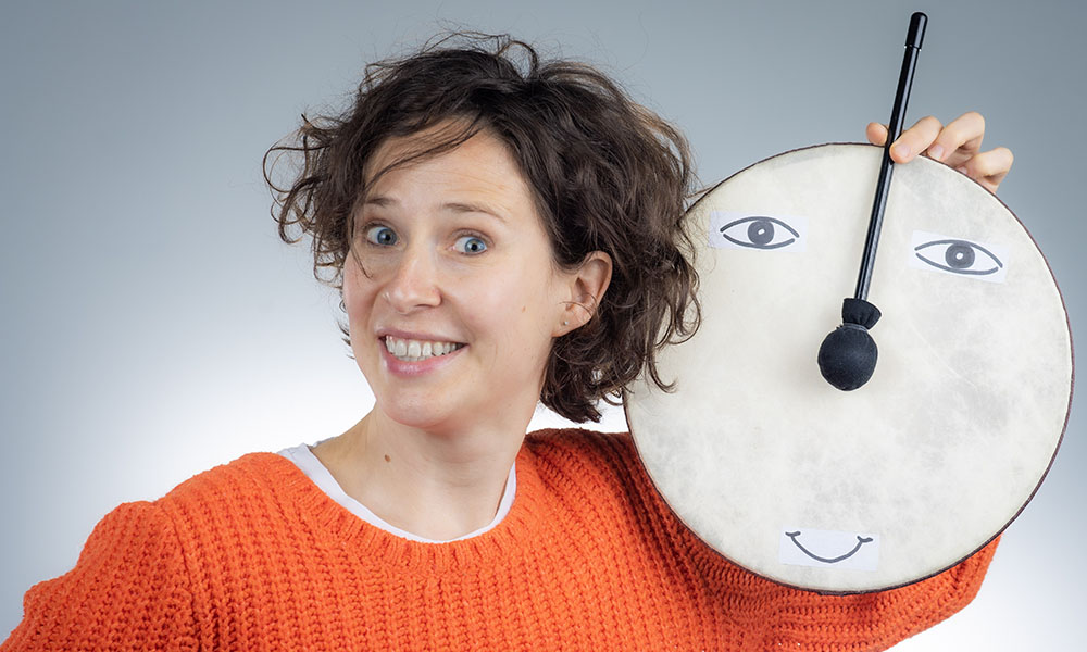 Natasha Mirny of Happy Theater with a drum