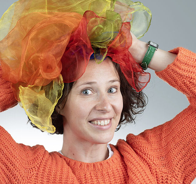 Natasha Mirny of Happy Theater with scarves