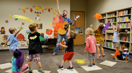 Kevin Alan Brown entertains a class of children
