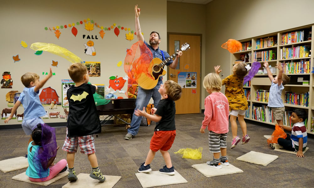 Kevin Alan Brown entertains a class of children