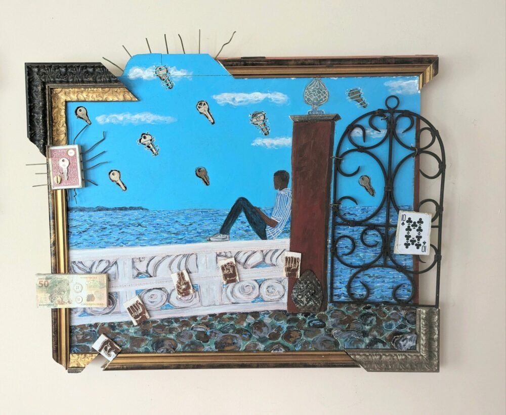 A collage consisting of a painting of a young man sitting on a sea wall, his back against a thick post supporting an ornate iron gate. Keys, evenly spaced, float through the clear sky. Playing cards and foreign currency are attached to the frame that surrounds it.