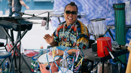 Dendê Macêdo plays the drums