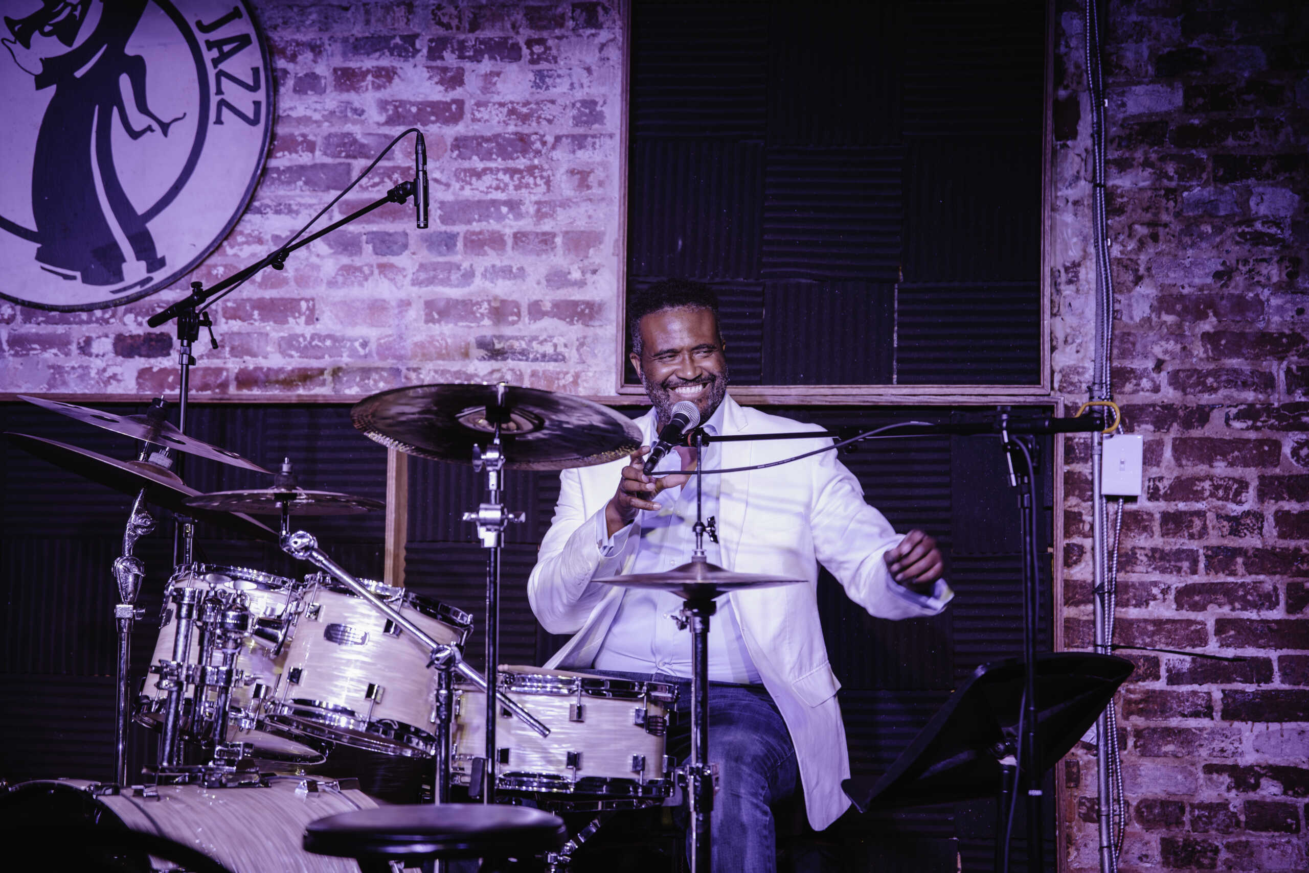 Vinton Jones smiles behind a drum set.