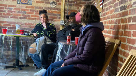 Participants sit and chat