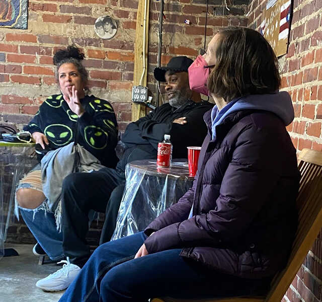 Participants sit and chat