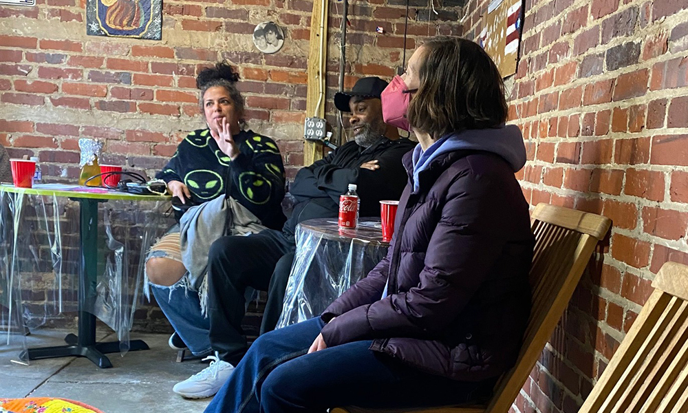 Participants sit and chat