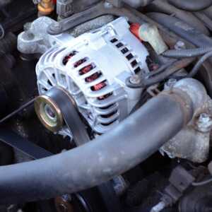 Lightly rusted old engine with new alternator installed