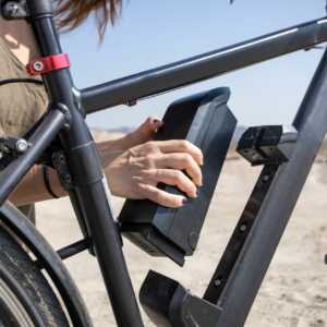 e-bike battery being installed on a bike frame 