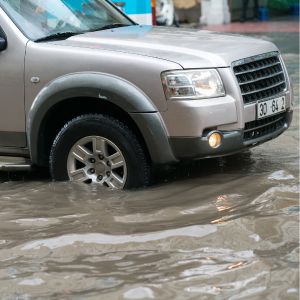SUV driving through flood water