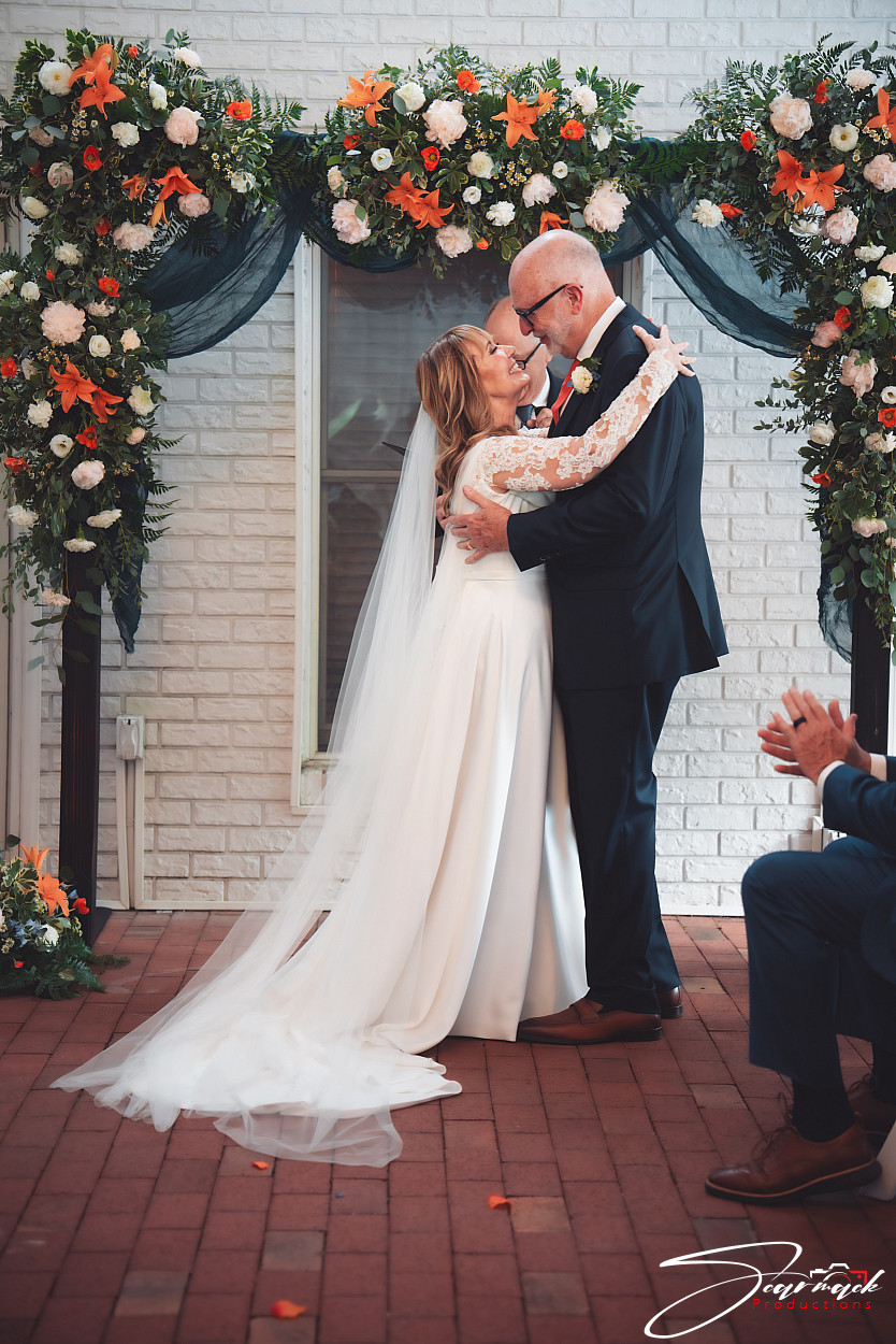 Melinda and Jim during their wedding ceremony at Tara A Country Inn