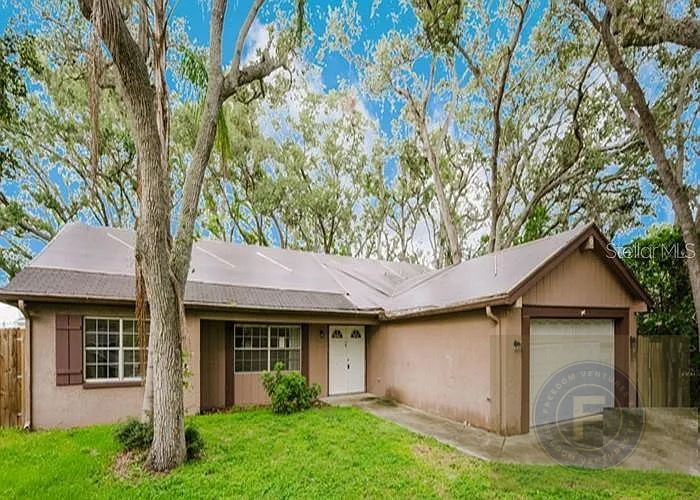 GREAT FIX AND FLIP OR BUY AND HOLD IN 1243 Royal Oak Dr, Dunedin, FL 34698