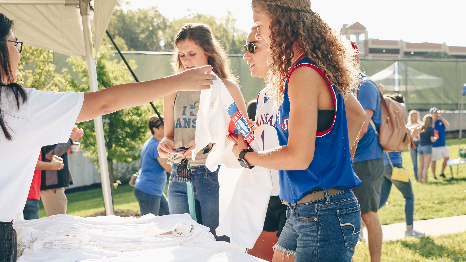 student tailgate indiana state grabbing shirts