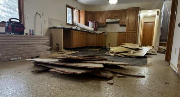 Removing particle board prior to installing wood floors