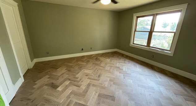White oak herringbone patterned flooring with rubiomonocoat in Stevens Point home.