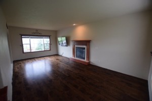 stained maple plank wood floor completed