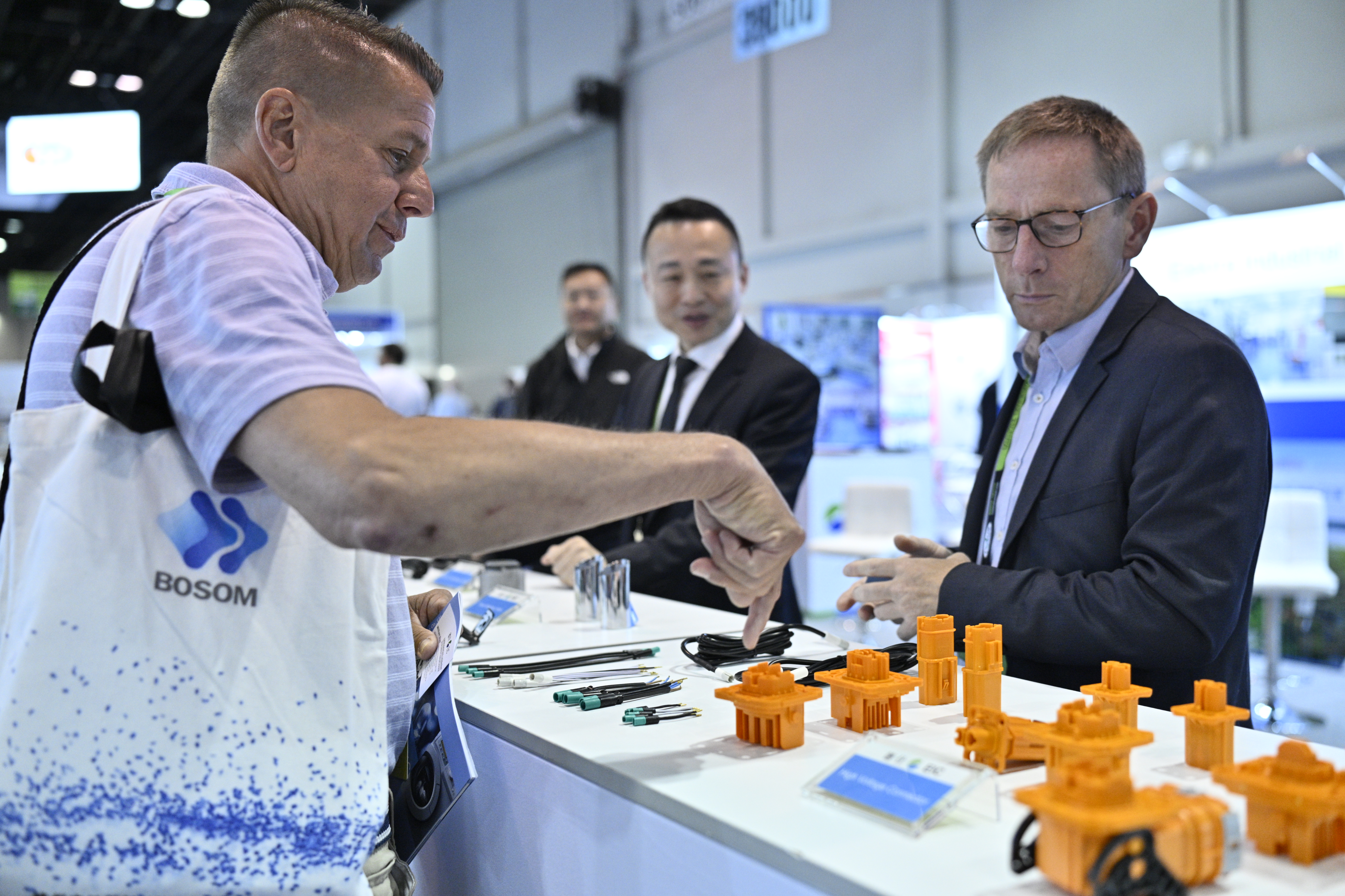 Attendees examining products in an NPE technology zone