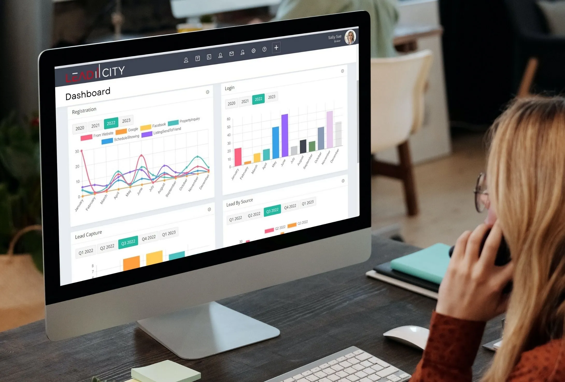 people-on-laptop-with-tablet-with-lead-city people-on-laptop-with-tablet-with-lead-city