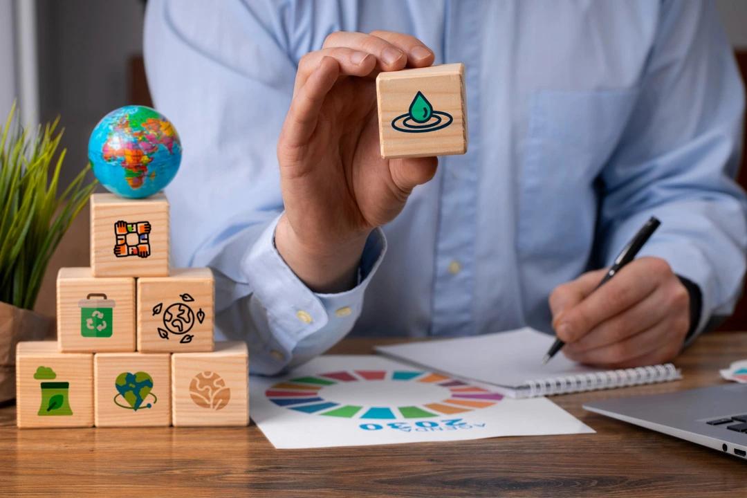 Pyramid of blocks with sustainability icons showcasing a business USP.